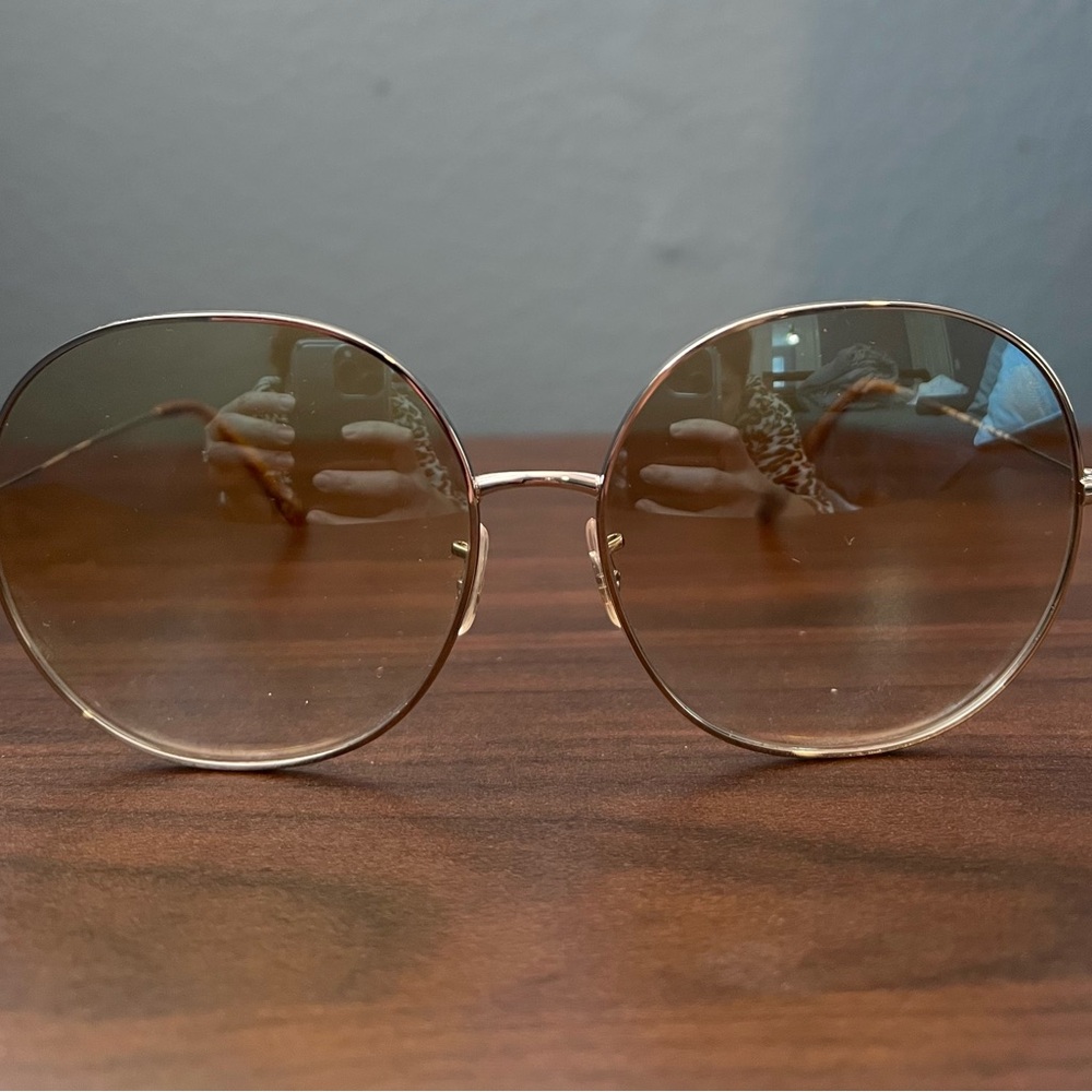 Oliver Peoples Gold Sunglasses with Oversized Round Lenses and Thin Metal Frame